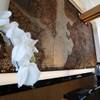 A wall sculpture by Margaret Boozer that uses soil taken directly from MGM National Harbor's construction site, is seen behind the hotel lobby desk, during a preview tour of the MGM National Harbor, Friday, Dec. 2, 2016 in Oxon Hill, Md. The $1.4 billion National Harbor casino and resort, just outside the nation's capital, is scheduled to open Dec. 8. 