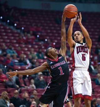Incarnate Word power guard Jalin Hart (1) gets a hand on the ball as UNLV guard Jalen Poyser (5) attempts a shot during their game at the Thomas & Mack Center on Wednesday, Dec. 14, 2016.