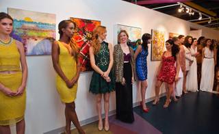 Models line up as local designer Ermelinda Manos presents a combo fashion show and book release for her 