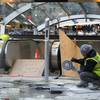 A construction worker cuts stone near an entrance of the unfinished Second Avenue subway in New York. Nearly 45 years after construction began, a long-delayed subway line beneath Manhattan’s east side faces a Dec. 31 deadline to open.