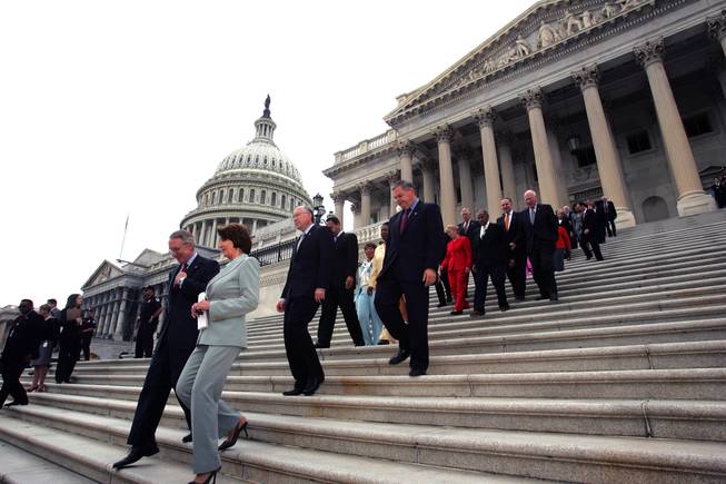 Reid and House Democratic leader Nancy Pelosi with other House and Senate Democratic senators and representatives on the steps of the U.S. Capitol in 2005.