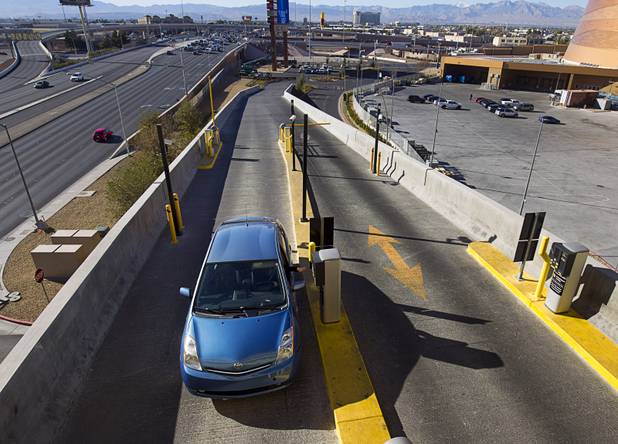 A driver enters the New York-New York parking garage Tuesday, Dec. 20, 2016.