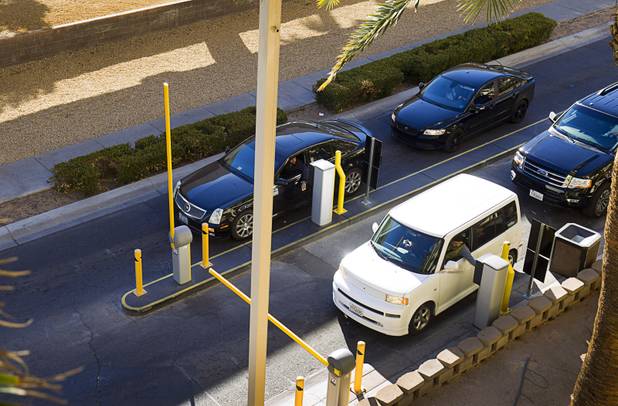 Drivers stop for tickets as they enter the MGM Grand parking garage Tuesday, Dec. 20, 2016.