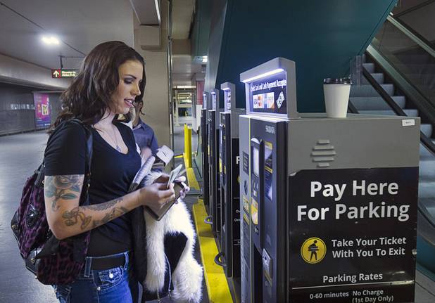 Christi Callahan pays for her parking at the MGM Grand parking garage Tuesday, Dec. 20, 2016.
