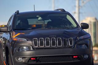 Damage is shown on Jeep SUV after a 55-year-old Las Vegas man was killed by a suspected drunk driver on Flamingo Road near Maryland Parkway early Christmas morning, Dec. 25, 2016.