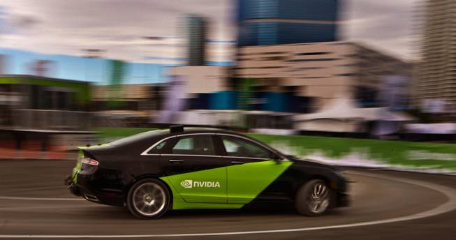 A Nvidia-Audi vehicle is driven on a test track during the opening day of CES 2017 at the Las Vegas Convention Center on Thursday, Jan. 5, 2017.  They are developing a self-driving autonomous vehicle on the roads by 2020..