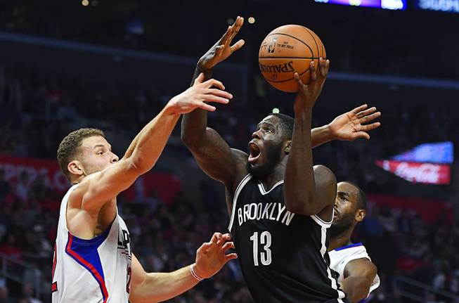 Brooklyn Nets forward Anthony Bennett, right, shoots as Los Angeles Clippers forward Blake Griffin defends during the first half of an NBA basketball game, Monday, Nov. 14, 2016, in Los Angeles.