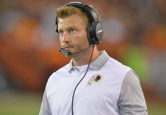In this Thursday, Aug. 13, 2015, file photo, Washington Redskins offensive coordinator Sean McVay stands on the sideline during an NFL preseason football game against the Cleveland Browns in Cleveland. The Los Angeles Rams have made Sean McVay the youngest head coach in NFL history. The Rams on Thursday, Jan. 12, 2017m hired McVay, who turns 31 years old on Jan. 24.