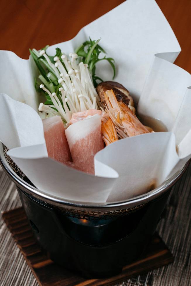 Hot pot yosenabe scallop, salmon, shrimp, oyster, black pork, napa, enoki, mizen, and shiitake mushroom from the Kaiseki menu at Yuzu on Jan. 10, 2017.