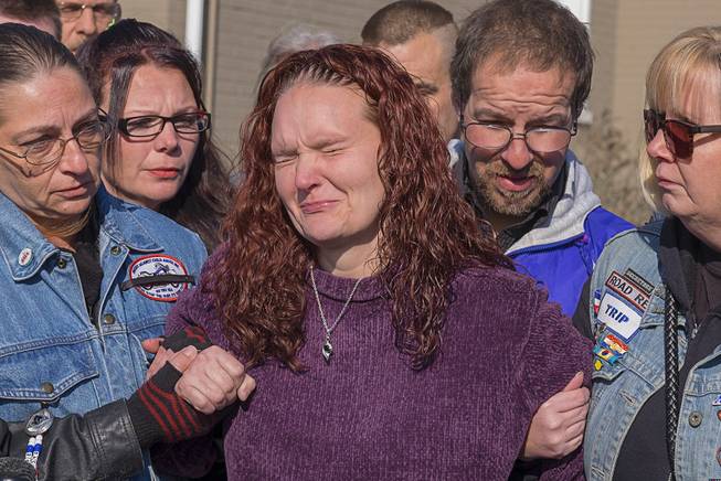 A distraught Rose Hunsicker, center, the biological mother of Grace Packer, is escorted to the church by members of her family and members of Bikers Against Child Abuse Monday, Jan. 16, 2017, on her way in to a memorial service for Packer, the local teen who who authorities say was killed and dismembered by her adoptive mother and her boyfriend, at the New Life Presbyterian Church in Glenside, Pa. 