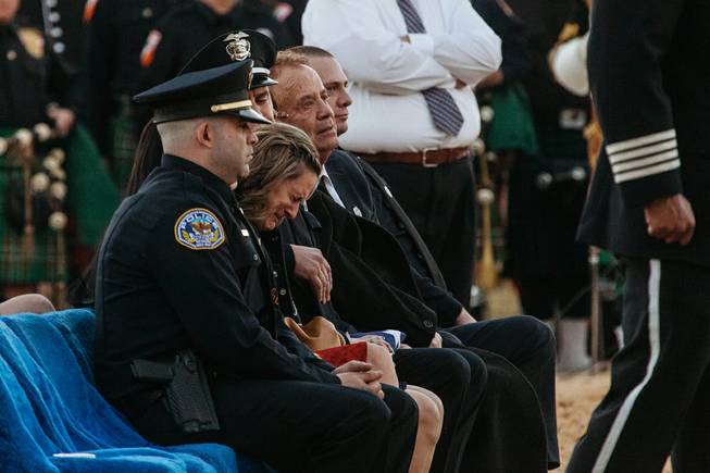 Family members of North Las Vegas Police Detective Chad Parque grieve during his memorial service at Palm Mortuary Northwest on Tuesday, Jan. 17, 2017. Parque died from injuries sustained in a Jan. 6 head-on collision while on duty.