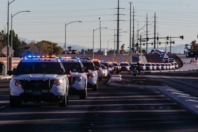 A procession heads to Palm Mortuary Northwest for a memorial service for North Las Vegas Police Detective Chad Parque, 32, Tuesday, Jan. 17, 2017. Parque died from injuries sustained in a Jan. 6 head-on collision while on duty.