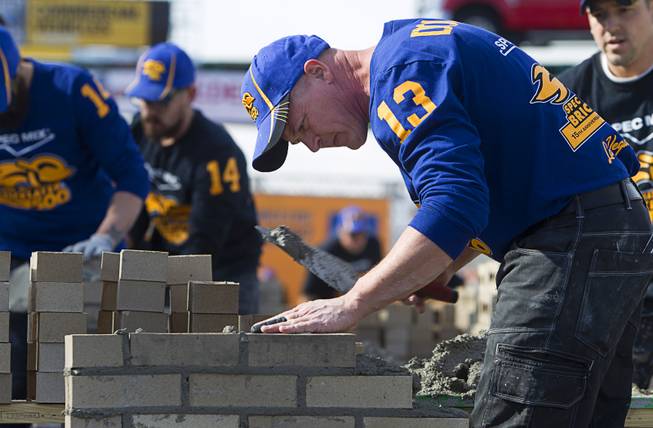 Darian Douthitt, of Providence Masonry in Miami, Okla., competes in the 15th Anniversary Spec Mix Bricklayer 500 during the World of Concrete convention at the Las Vegas Convention Center Wednesday, Jan. 18, 2017. Douthitt was a 2016 Spec Mix Top Craftsman winner. Top masons from across North America, and one from England, competed to build the best brick wall in one hour.