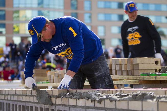 Scott Tuttle, of Quik Trowel in Clearfield, Utah, competes in the 15th Anniversary Spec Mix Bricklayer 500 during the World of Concrete convention at the Las Vegas Convention Center Wednesday, Jan. 18, 2017. Tuttle was the 2016 champion in the event. Top masons from across North America, and one from England, competed to build the best brick wall in one hour.