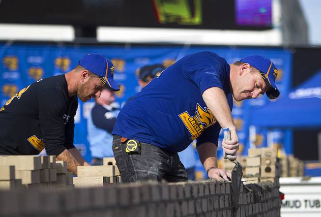 Leslie Weston of Ilfracombe, Devon, England, competes in the 15th Anniversary Spec Mix Bricklayer 500 during the World of Concrete convention at the Las Vegas Convention Center Wednesday, Jan. 18, 2017. Top masons from across North America, and one from England, competed to build the best brick wall in one hour.