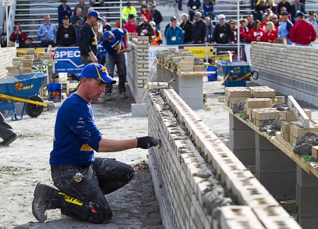Jake Brock, of Brock Construction in Ft. Atkinson, Wis., competes in the 15th Anniversary Spec Mix Bricklayer 500 during the World of Concrete convention at the Las Vegas Convention Center Wednesday, Jan. 18, 2017. Top masons from across North America, and one from England, competed to build the best brick wall in one hour.