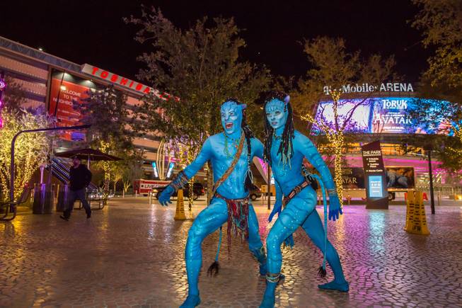 Cast members from Cirque Du Soliel's TORUK- The First Flight interact with tourists during "Party at the Park" in front of the T-Mobile Arena, Tuesday Jan 17, 2017.