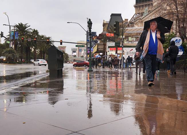 A pedestrian heads southbound on the Las Vegas Strip Sunday, Jan. 22, 2017. 