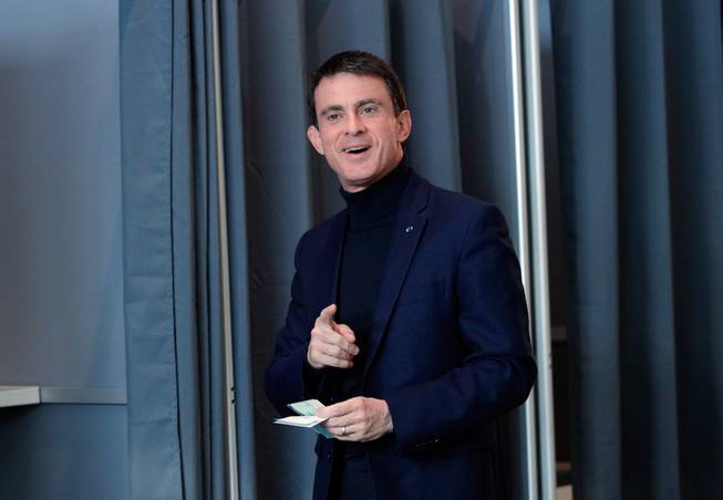 Former French Prime Minister and candidate for the French left's presidential primaries ahead of the 2017 presidential election Manuel Valls arrives Sunday, Jan. 22, 2017, to cast his vote during the first round of the Socialist party primary election in Evry, south of Paris.
