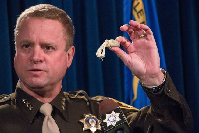 Clark County Undersheriff Kevin McMahill on Tuesday, Jan. 24, 2017, holds a bean-bag shotgun round similar to ones used by a Metro Police officer in Jean to try to stop a knife-wielding man who was subsequently shot to death.