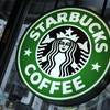 This Dec. 20, 2010, file photo, shows signage at a Starbucks store in New York.