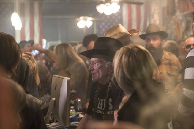 Country music legend Willie Nelson speaks to fans during an event celebrating the collaboration between Willie's Reserve and Redwood Cultivation at Exhile in downtown Las Vegas, Tuesday Jan. 31, 2017.