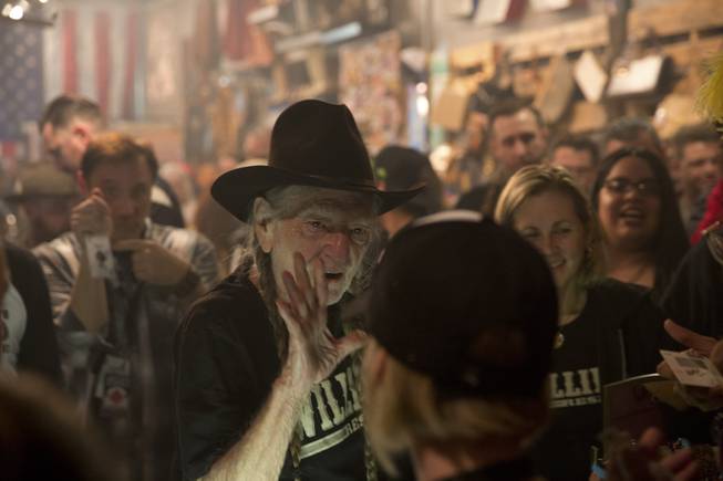Country music legend Willie Nelson speaks to fans during an event celebrating the collaboration between Willie's Reserve and Redwood Cultivation at Exhile in downtown Las Vegas, Tuesday Jan. 31, 2017.