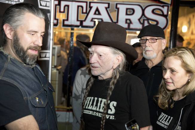 Country music legend Willie Nelson speaks to fans during an event celebrating the collaboration between Willie's Reserve and Redwood Cultivation at Exile on Main Street in downtown Las Vegas, Tuesday Jan. 31, 2017.
