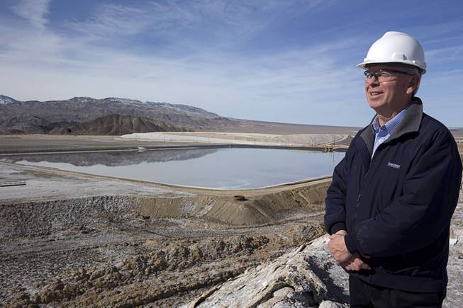 John Mayes, site manager for the Silver Peak lithium mine,  looks over the mines evaporation ponds during a tour of the mine near Tonopah, Nev. Monday, Jan. 30, 2017.