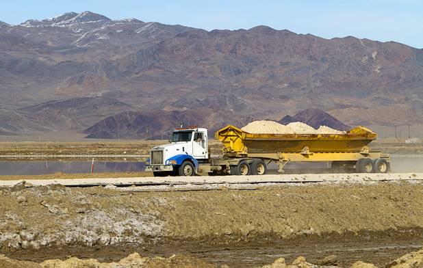 A truck carries away waste salt at the Silver Peak lithium mine near Tonopah, Nev. Monday, Jan. 30, 2017.