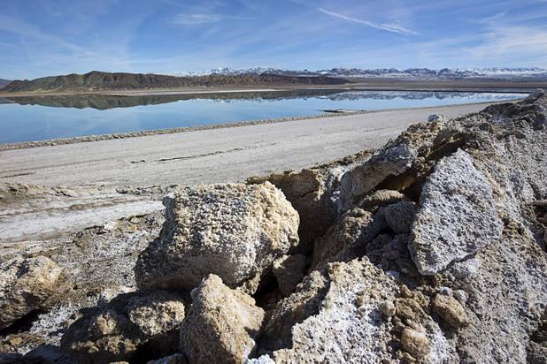 Waste salt, foreground, is shown near an evaporation pond at the Silver Peak lithium mine near Tonopah, Nev. Monday, Jan. 30, 2017.