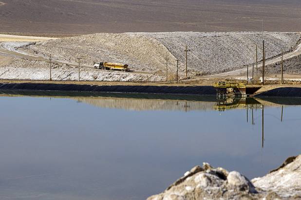 A truck carries away waste salt at the Silver Peak lithium mine near Tonopah, Nev. Monday, Jan. 30, 2017.