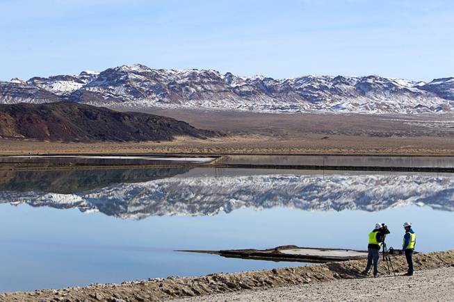 A KLAS-Channel 8 news crew takes footage of an evaporation pond during a tour of the Silver Peak lithium mine near Tonopah, Nev. Monday, Jan. 30, 2017.