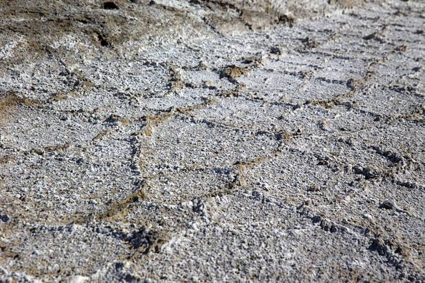 Waste salts leave a crusty pattern on the ground at the Silver Peak lithium mine near Tonopah, Nev. Monday, Jan. 30, 2017.