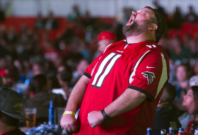 Falcons fan Rodney Grimes of Ringgold, Ga. reacts to a play during the Big Game Bash at the Downtown Las Vegas Events Center Sunday, Feb. 5, 2017. .