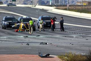 Car parts and debris litter the roadway after a fatal accident at Durango Drive and Farm Road Thursday, Feb. 9, 2017.