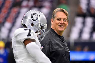 In this Saturday, Jan. 7, 2017, file photo, Oakland Raiders coach Jack Del Rio walks on the field before the first half of an AFC wild card NFL football game between the Houston Texans and the Raiders in Houston. The Raiders rewarded Del Rio with a new four-year contract Friday, Feb. 10, 2017, replacing the original four-year deal he received when he took the job in January 2015.