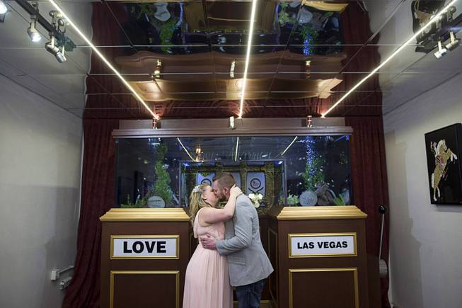 Danielle Nash and Brock Robinson of Marysville, Wash. kiss after getting married in the Casino Wedding Chapel during a Valentine's Day wedding in downtown Las Vegas Tuesday, Feb. 14, 2017.  .