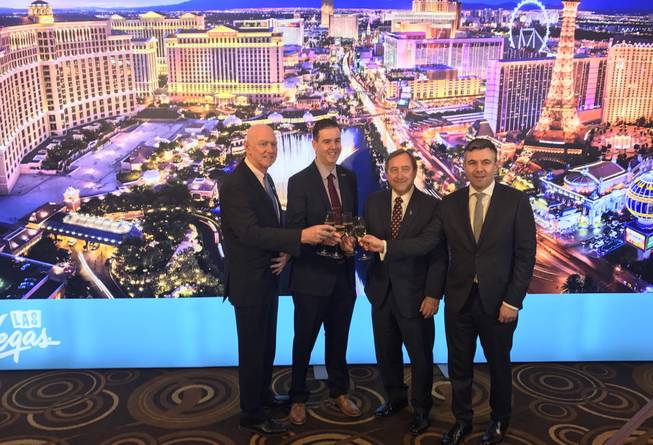 From left, Clark County Commissioner Larry Brown, Aviation Department CMO Chris Jones, LVCVA President/CEO Rossi Ralenkotter and Routes Americas Brand Director Steven Small mark the opening of the Routes America travel conference at Aria on Feb. 15, 2017.