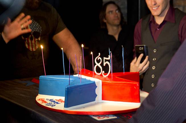 A birthday cake is brought out for Granny Rich, grandmother of country singer John Rich, during the grand opening of Redneck Riviera, a country bar in the Grand Bazaar Shops in front of Bally's, Thursday, Feb. 16, 2017. .