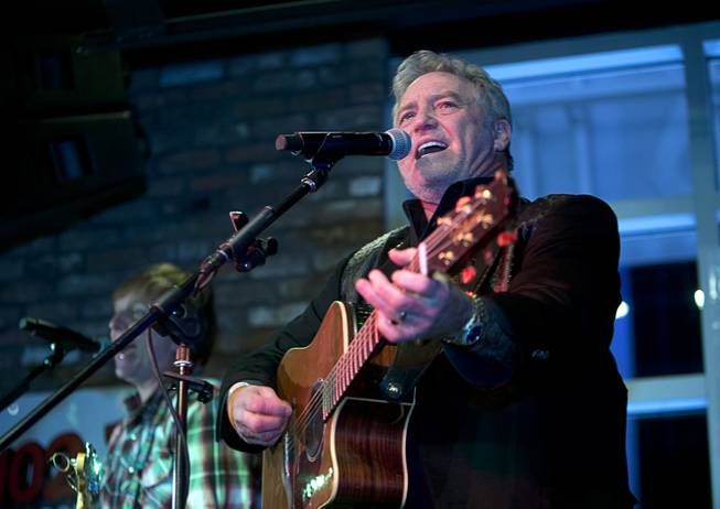Country singer Larry Gatlin performs during the grand opening of John Rich's Redneck Riviera, a country bar in the Grand Bazaar Shops in front of Bally's, Thursday, Feb. 16, 2017. .