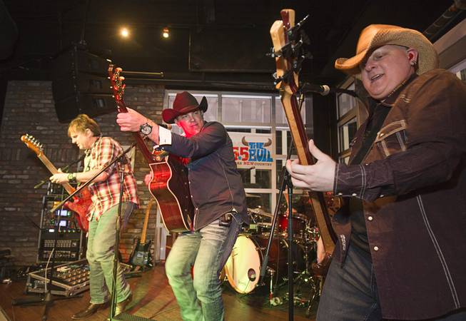 Members of the Tony Marques Band perform during the grand opening of John Rich's Redneck Riviera, a country bar in the Grand Bazaar Shops in front of Bally's, Thursday, Feb. 16, 2017. From left: Tommy Cameron, Tony Marques, and Mike Riojas. .