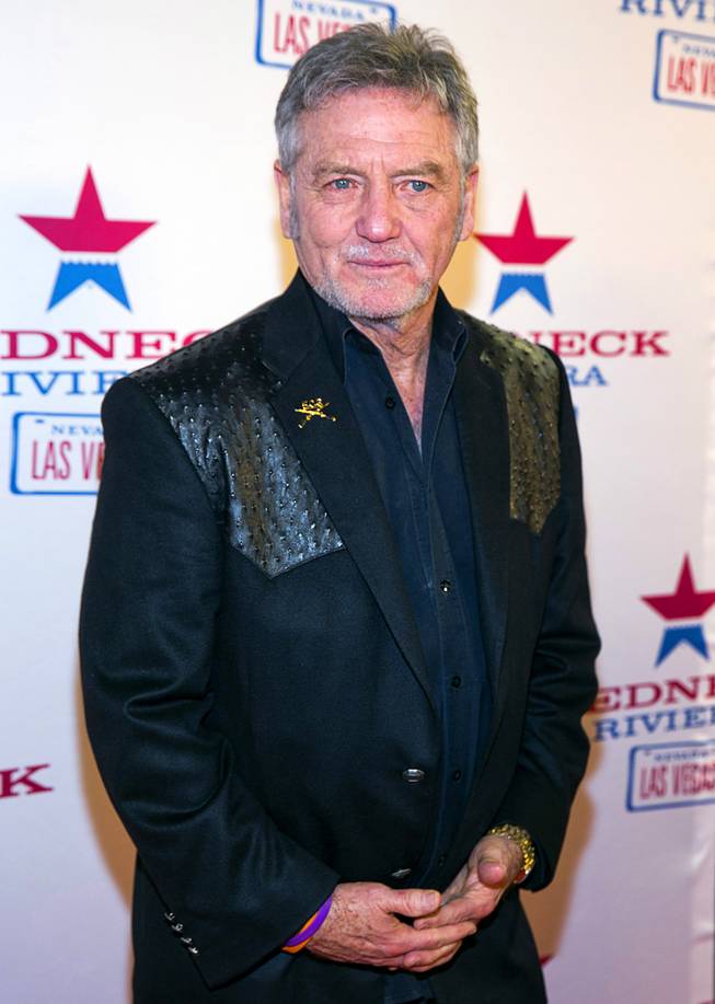 Country singer Larry Gatlin arrives for the grand opening of John Rich's Redneck Riviera, a country bar in the Grand Bazaar Shops in front of Bally's, Thursday, Feb. 16, 2017. .