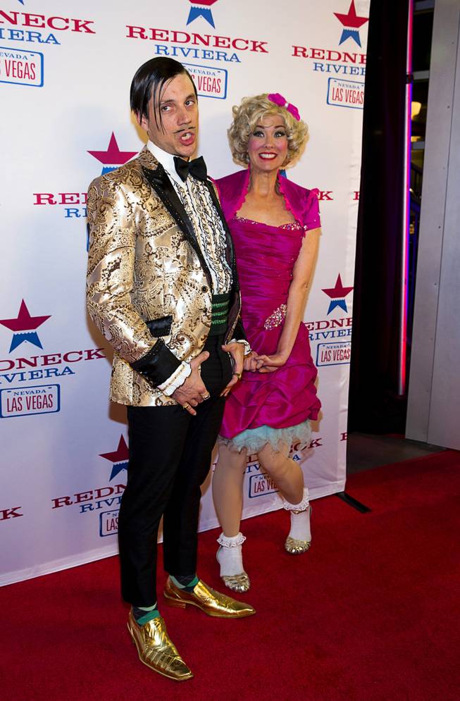 The Gazillionaire and his assistant Wanda Widdles, performers in Absinthe at Caesars Palace, arrive for the grand opening of John Rich's Redneck Riviera, a country bar in the Grand Bazaar Shops in front of Bally's, Thursday, Feb. 16, 2017. .