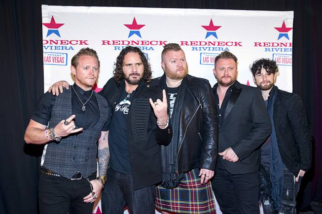 Members of Tenors of Rock, a British vocal group, pose during the grand opening of John Rich's Redneck Riviera, a country bar in the Grand Bazaar Shops in front of Bally's, Thursday, Feb. 16, 2017. The group performs at Harrah's Las Vegas. .