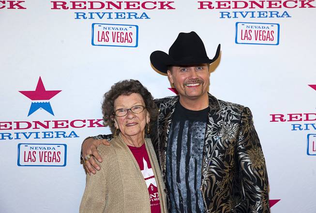 Country singer John Rich, of the music duo Big & Rich, and his grandmother "Granny Rich" pose on the red carpet during the grand opening of John Rich's Redneck Riviera, a country bar in the Grand Bazaar Shops in front of Bally's, Thursday, Feb. 16, 2017. .