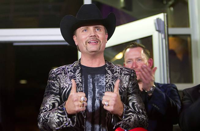 Country singer John Rich, of the music duo Big & Rich, gives two thumbs up during the grand opening of Redneck Riviera, a country bar in the Grand Bazaar Shops in front of Bally's, Thursday, Feb. 16, 2017. .