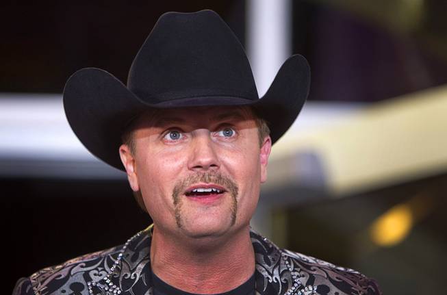 Country singer John Rich, of the music duo Big & Rich, speaks during the grand opening of Redneck Riviera, a country bar in the Grand Bazaar Shops in front of Bally's, Thursday, Feb. 16, 2017. .