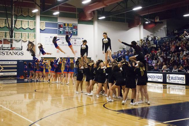 Clark's and Bishop Gormans cheer teams perform during a time out in the Sunset Regional championship at Shadow Ridge High School on Feb. 18, 2017.