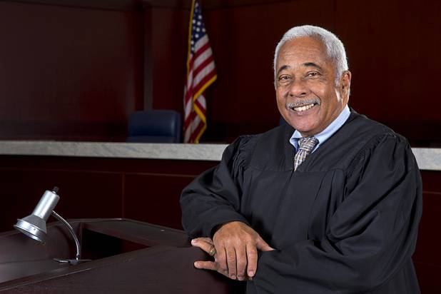 Nevada Supreme Court Justice Michael L. Douglas poses in his courtroom Tuesday, Feb. 21, 2017. .